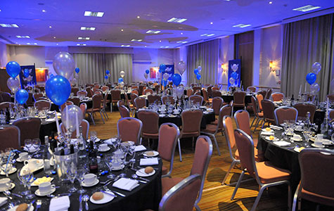 Photograph of an empty dining room before corporate guests begin eating