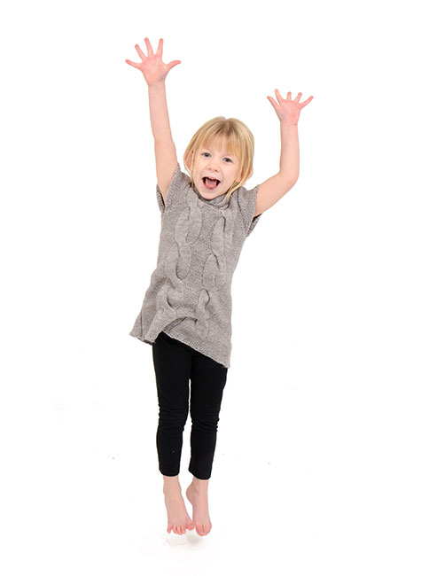 Young girl jumping mid-air